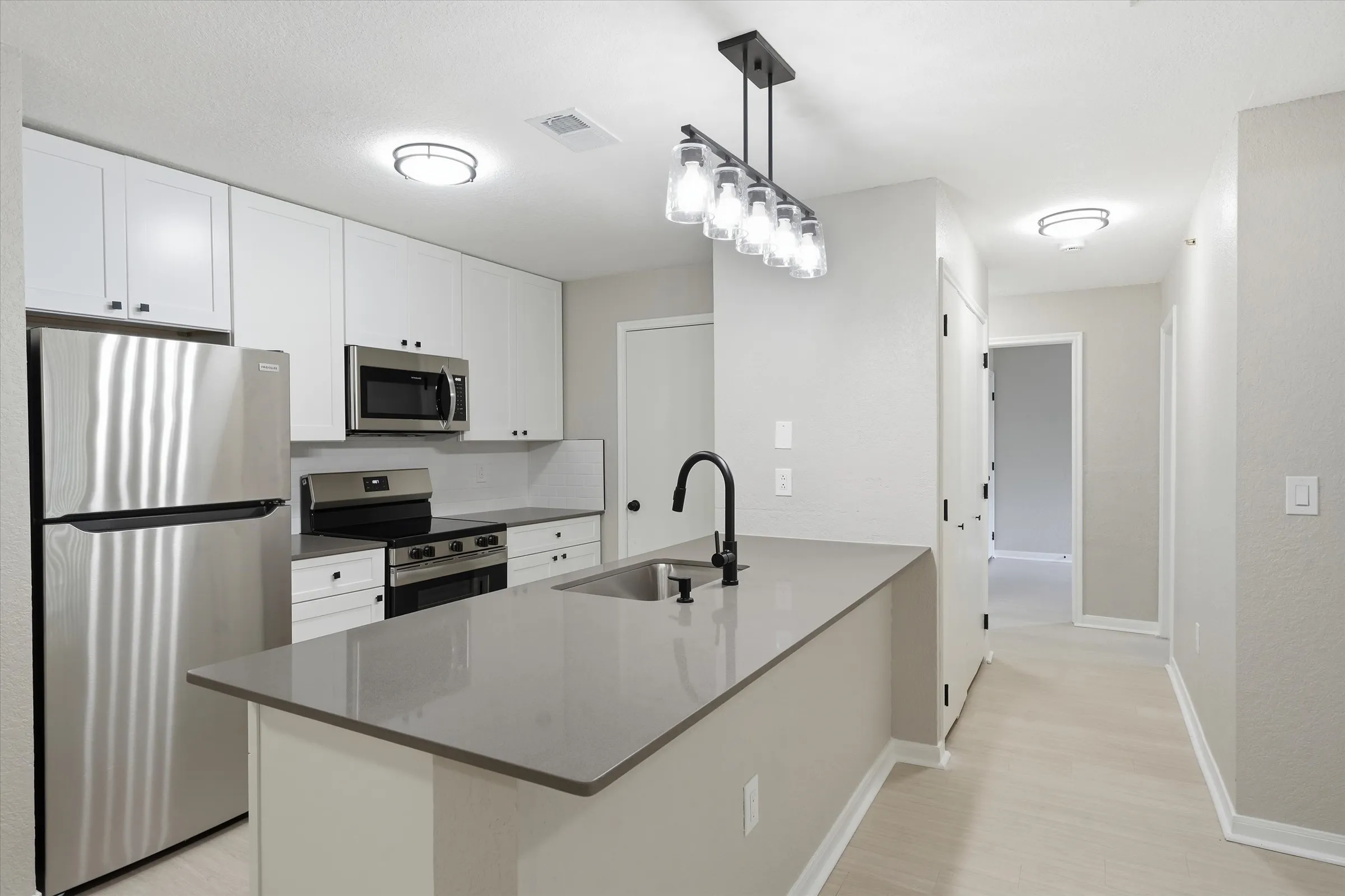 The Villas @ North Oak — kitchen and living room